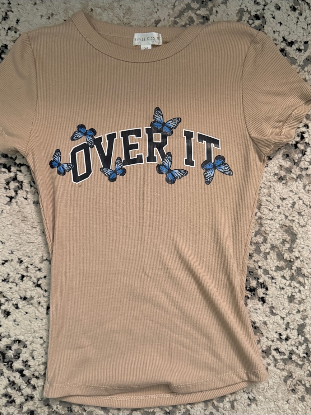 Free Kisses Beige Ribbed Tee with Blue Butterfly "OVER IT" Graphic